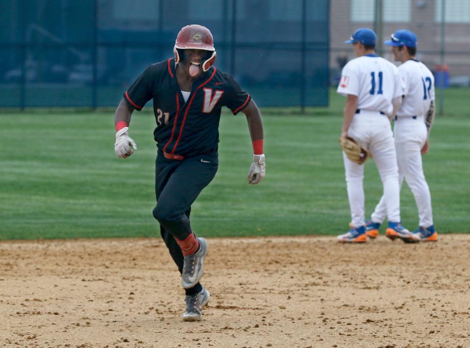 Vineland's Yoan Feliz (#21) runs the bases after hitting a 7th inning home run against Millville Monday afternoon, May 1, 2023. 