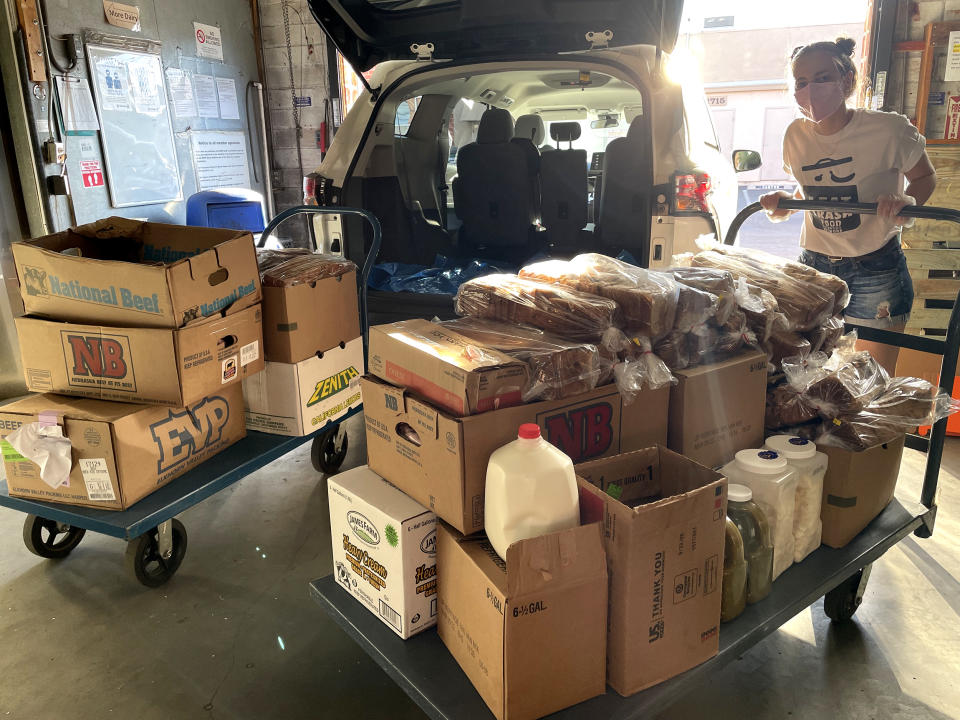 Volunteers load surplus food to donate from the 2022 Super Bowl in Los Angeles, California. (Courtesy Food Recovery Network)