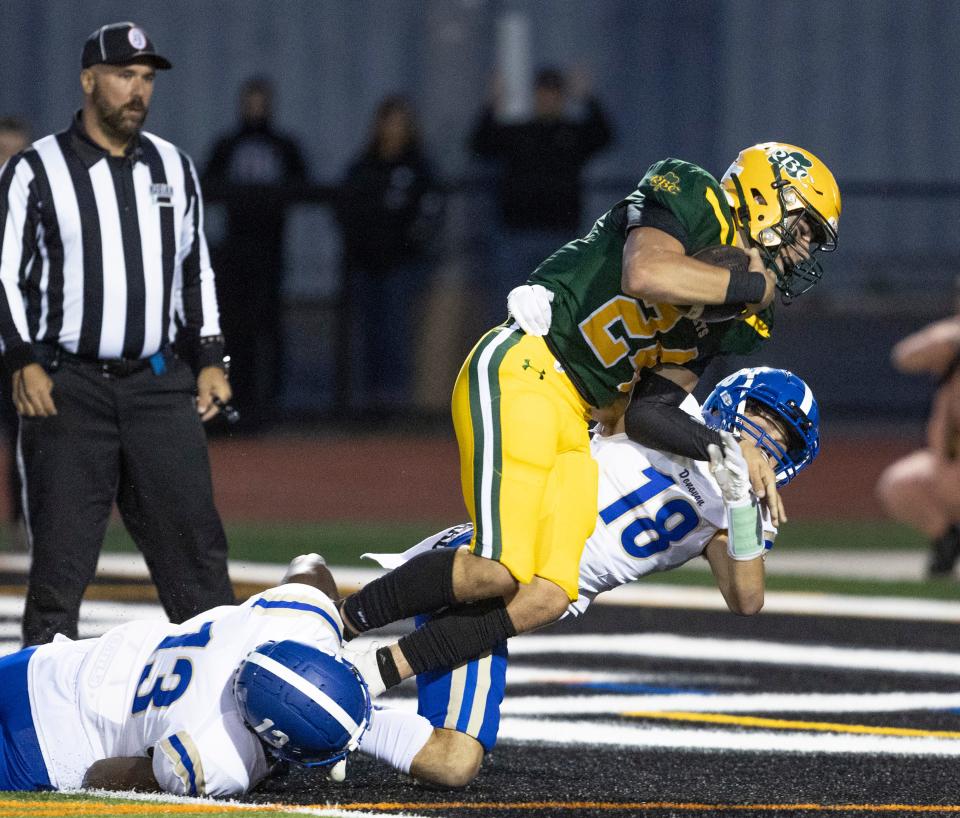 Red Bank Catholic senior running back Sabino Portella dives into the end zone for the Caseys' second touchdown in their 14-7 win over Donovan Catholic on Friday night.