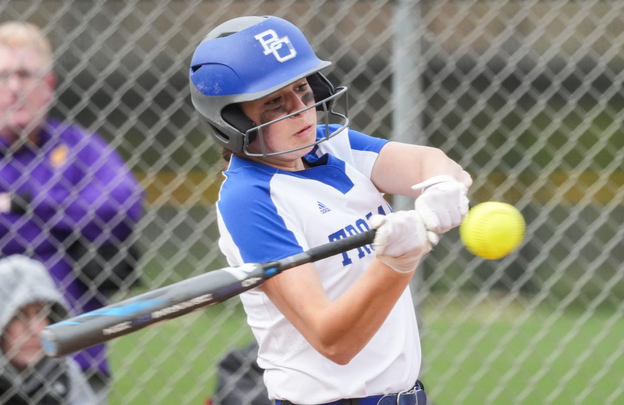 Bishop Chatard Trojans Anna Caskey (21) hits the ball on Wednesday, April 20, 2022, at Guerin Catholic High School in Noblesville. 
