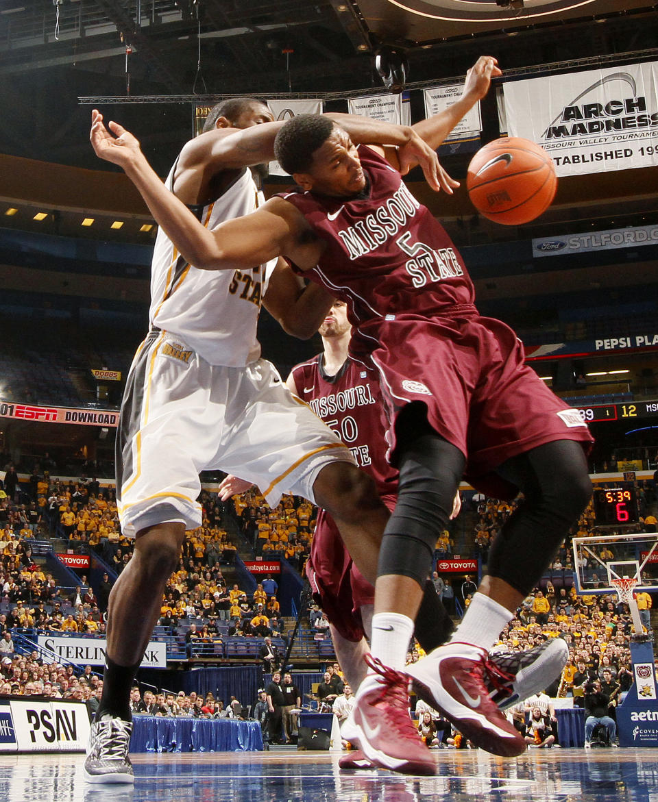 Wichita State center Kadeem Coleby, left, competes for a rebound against Missouri State forward Jarmar Gulley during the first half of an NCAA college basketball game in the semifinals of the Missouri Valley Conference men's tournament Saturday, March 8, 2014, at the Scottrade Center in St. Louis. (AP Photo/St. Louis Post-Dispatch, Chris Lee) EDWARDSVILLE INTELLIGENCER OUT; THE ALTON TELEGRAPH OUT