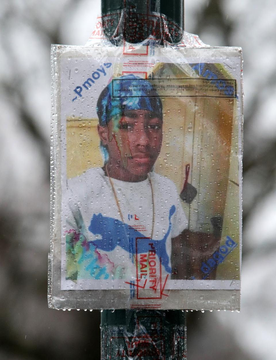 A photo of 14-year-old Zyaire Fernandez is displayed at a memorial in the courtyard at Levister Towers in Mount Vernon March 13, 2023. Fernandez was fatally shot there March 9.