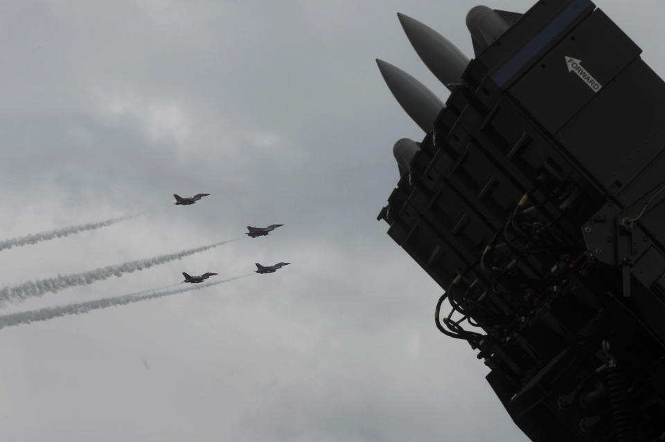 SPYDER, Rafael Advanced Defense Systems' surface-to-air missile system, is on display as F-16 fighter jets of the Singapore Air Force aerobatics team Black Knights perform on the fourth day of the Singapore Airshow in Singapore Friday, Feb. 14, 2014. Rafael Advanced Defense Systems developing a laser-based missile shield that evokes "Star Wars" style technology said its deployment over the country is closer to becoming a reality. The Israeli state-owned arms company said development of the system was advanced enough for the company to be comfortable with publicizing it at the airshow, which is Asia's largest aerospace and defense exhibition. (AP Photo/Joseph Nair)