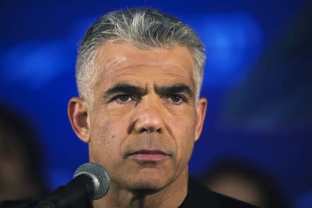 Yair Lapid, head of Yesh Atid party, speaks to supporters during a conference in Holon near Tel Aviv March 12, 2015. REUTERS/Amir Cohen