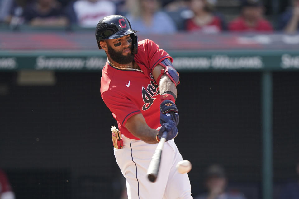 Cleveland Indians' Amed Rosario hits an RBI-single in the sixth inning of a baseball game against the Kansas City Royals, Monday, Sept. 27, 2021, in Cleveland. (AP Photo/Tony Dejak)