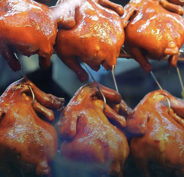 6 hanging roasted chicken, illustrating food options that can be found when embarking on Chinatown 