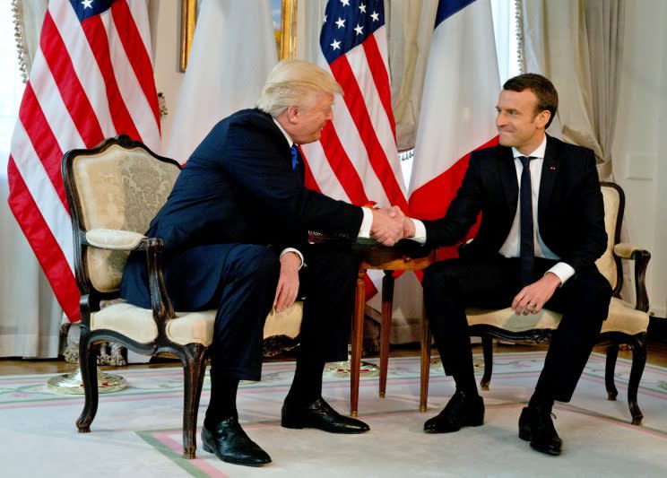 President Trump shakes hands with French President Emmanuel Macron before a working lunch before a NATO summit in Brussels May 25. (Peter Dejong/Pool via Reuters)