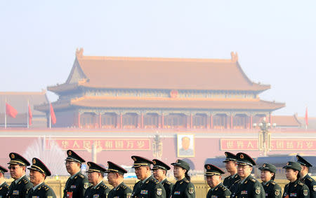 Military delegates arrive at the Great Hall of the People for a meeting ahead of National People's Congress (NPC), China's annual session of parliament, in Beijing, China March 4, 2019. REUTERS/Aly Song