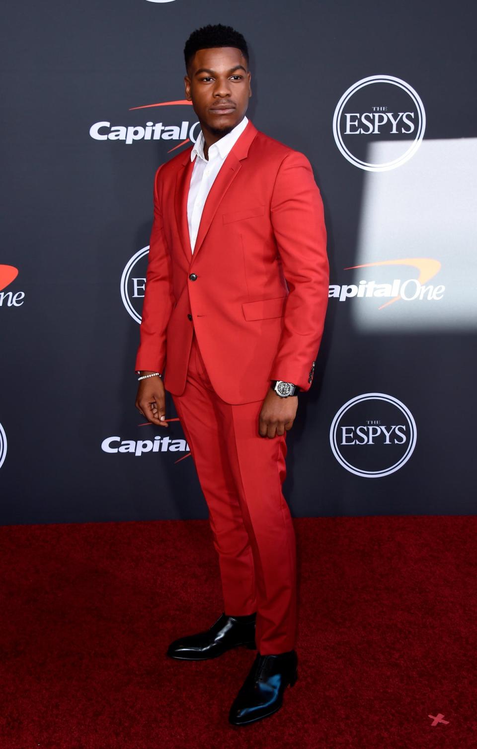 Boyega wore a blood red suit with an open white collar and later presented an award alongside rapper Lil Wayne (Jordan Strauss/AP) (AP)