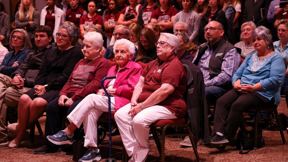 Judy Fugate, center, is surrounded by family, friends and a wall of WT women's athletes at a press conference announcing her legacy gift of $1.8 million to WT Athletics for women's sports.