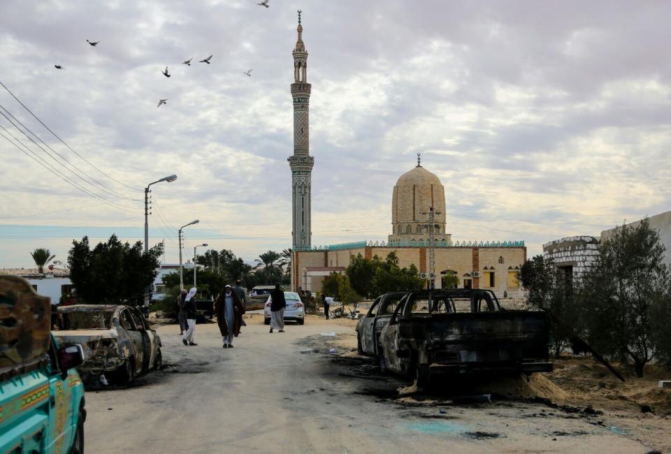 <p>Wreckages of cars are seen after the Egypt Sinai mosque bombing in Al-Arish, Egypt on Nov. 25, 2017. (Photo: Stringer/Anadolu Agency/Getty Images) </p>