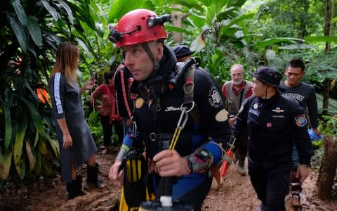 British cave-diver Richard William Stanton walks out from Tham Luang Nang Non cave in full kit w - Credit: Getty