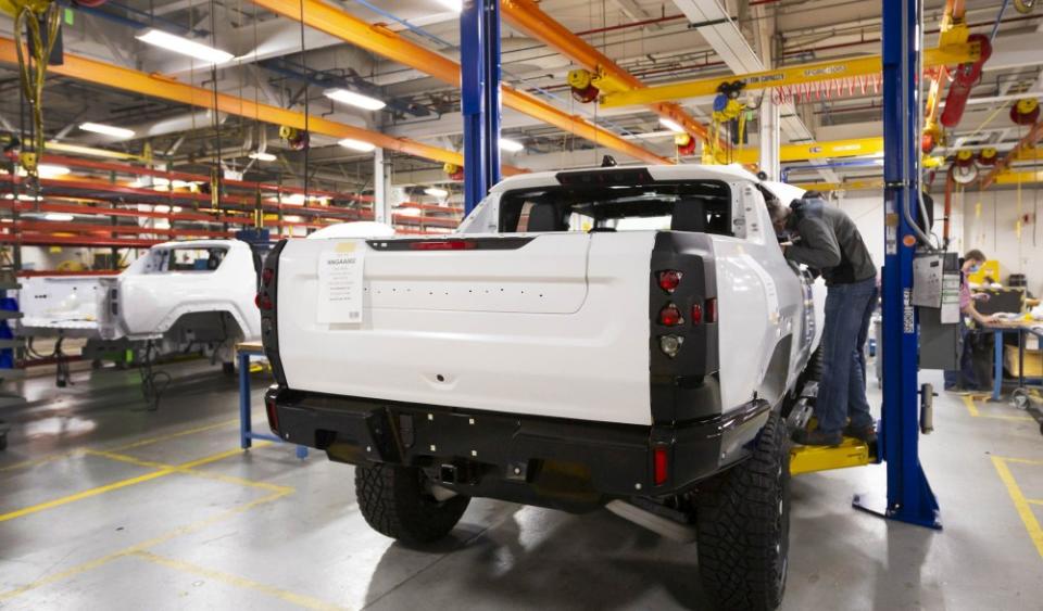 Two GMC HUMMER EVs completing their builds prior to shipping for continued validation testing.  (Photo by Jeffrey Sauger for General Motors)