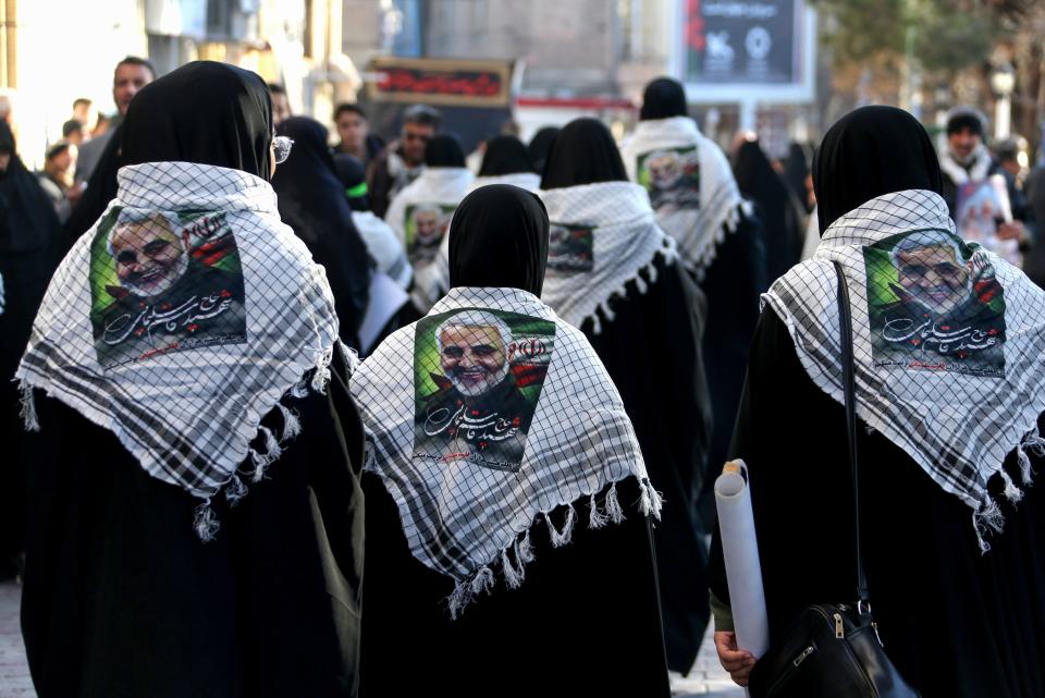 Iranian mourners gather during the final stage of funeral processions for slain top general Qasem Soleimani, in his hometown Kerman on January 7, 2020. - Soleimani was killed outside Baghdad airport on January 3 in a drone strike ordered by US President Donald Trump, ratcheting up tensions with arch-enemy Iran which has vowed "severe revenge". The assassination of the 62-year-old heightened international concern about a new war in the volatile, oil-rich Middle East and rattled financial markets. (Photo by ATTA KENARE / AFP) (Photo by ATTA KENARE/AFP via Getty Images)