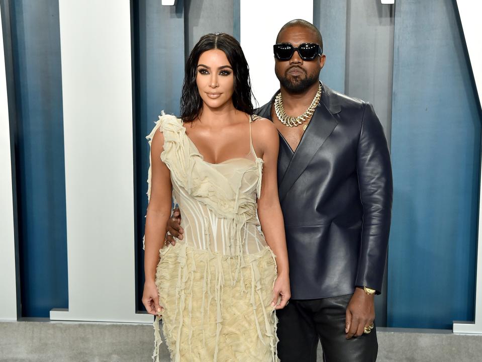 Kim Kardashian and Kanye West posing together.