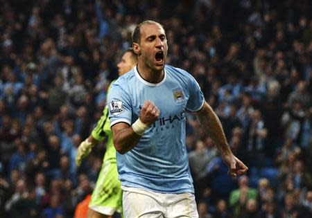 Manchester City's Pablo Zabaleta celebrates after scoring a goal against West Bromwich Albion during their English Premier League soccer match at the Etihad stadium in Manchester, northern England April 21, 2014. REUTERS/Nigel Roddis