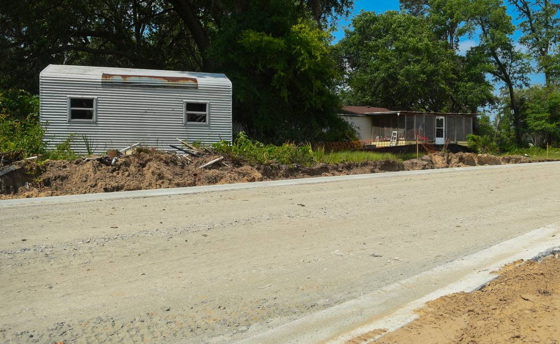 Infrastructure for a new development off Jonesville Road surrounds the Wright family property as seen on May 9, 2023 on Hilton Head Island. The shed at left was demolished by the family after the developer told them it was encroaching on the property of the future residential community.