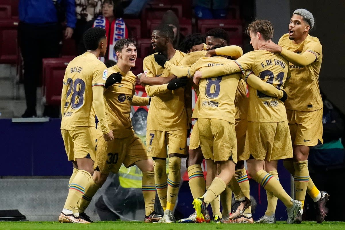 Barcelona’s Ousmane Dembele (third from left) celebrates with teammates after scoring the against Atletico Madrid (Manu Fernandez/AP). (AP)