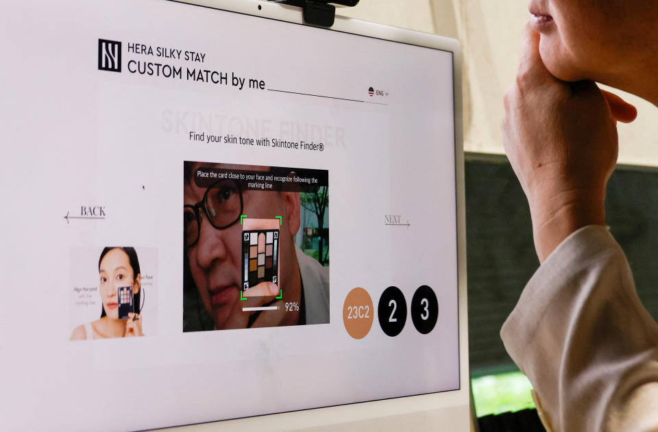 Lee Young-jin, a Ph.D in engineering and adviser for AmorePacific's custom beauty business, analyses skin color using AI technology during a demonstration, to get an optimal foundation shades recommendation at Amore Seongsu in Seoul, South Korea, June 7, 2024. REUTERS/Kim Soo-hyeon