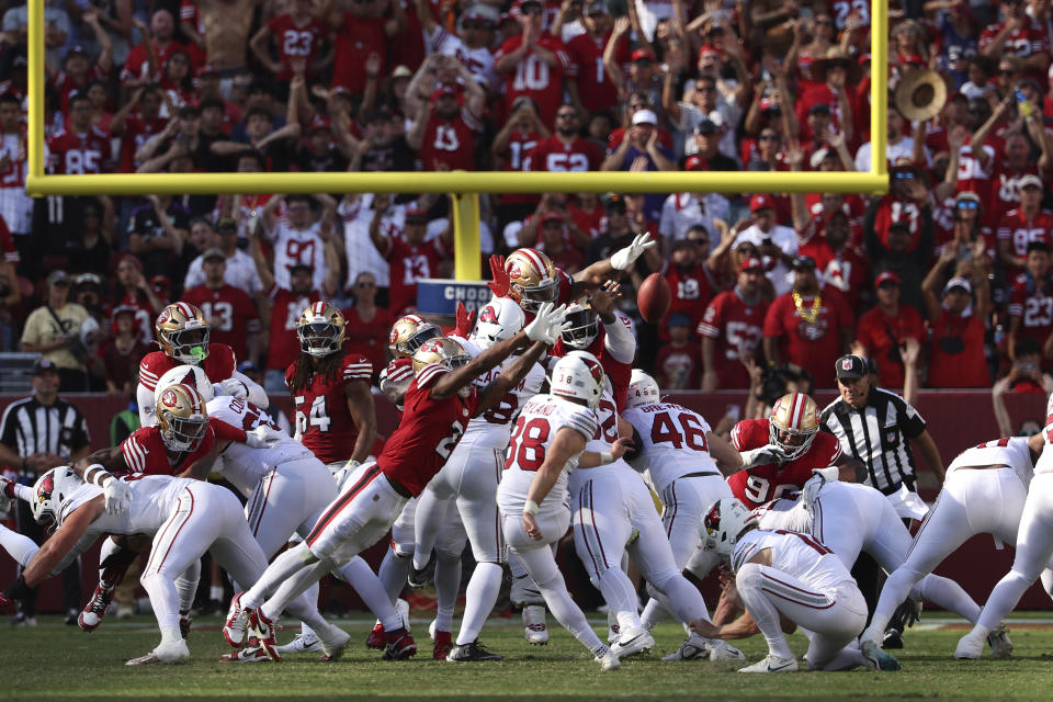 Arizona Cardinals place kicker Chad Ryland, bottom middle, kicks a field goal against the San Francisco 49ers during the second half of an NFL football game in Santa Clara, Calif., Sunday, Oct. 6, 2024. (AP Photo/Jed Jacobsohn)