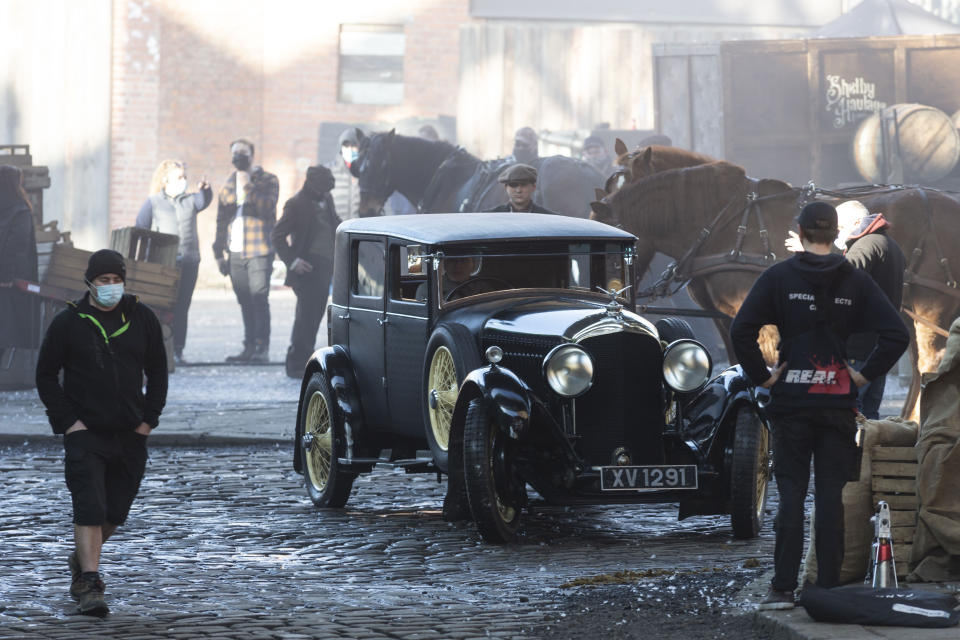 Extra and film crews prepare in between scenes. The filming of Peaky Bliders season 6 continues, in Manchester, pictured in Greater Manchester, March 2 2021. (SWNS)