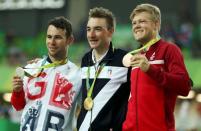 2016 Rio Olympics - Cycling Track - Victory Ceremony - Men's Omnium Victory Ceremony - Rio Olympic Velodrome - Rio de Janeiro, Brazil - 15/08/2016. Silver medalist Mark Cavendish (GBR) of Britain, gold medalist Elia Viviani (ITA) of Italy and bronze medalist Lasse Hansen (DEN) of Denmark pose on the podium. REUTERS/Matthew Childs