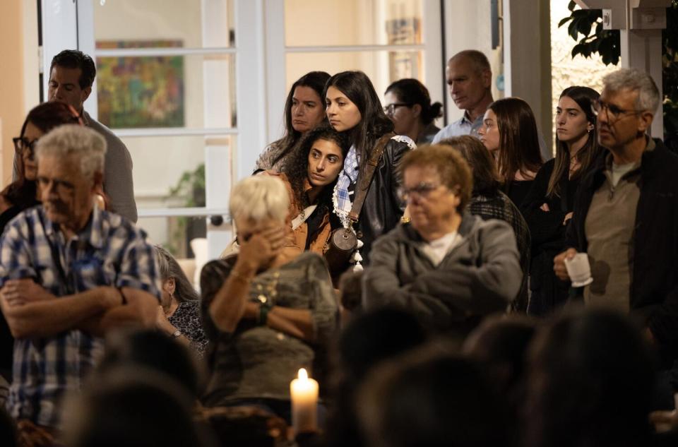 Guests listen to survivors' stories.