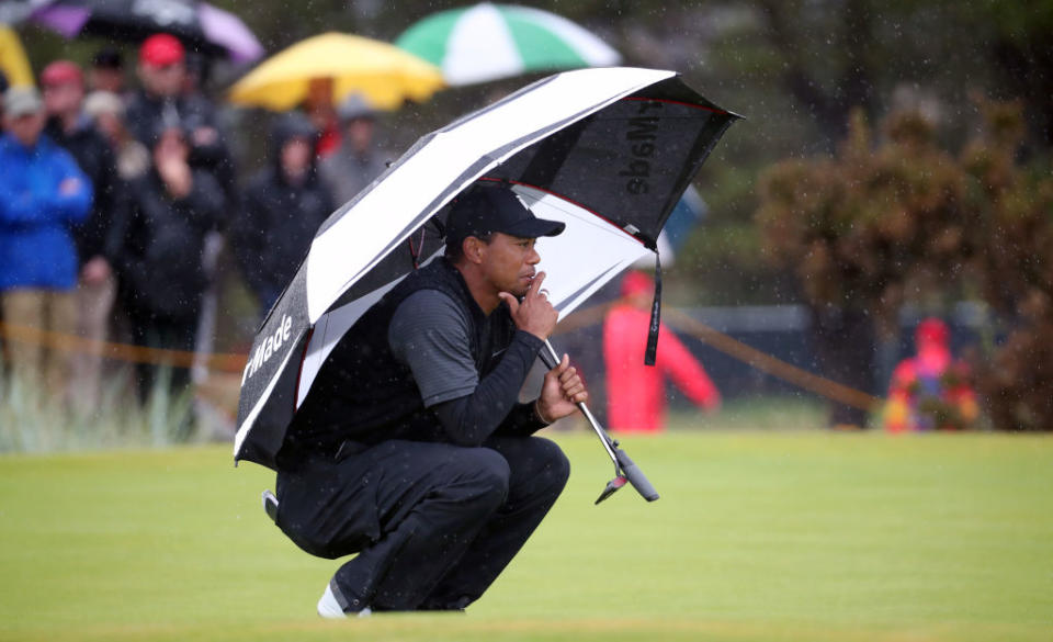 Tiger Woods slogged through a wet Friday at the British Open. (Getty)