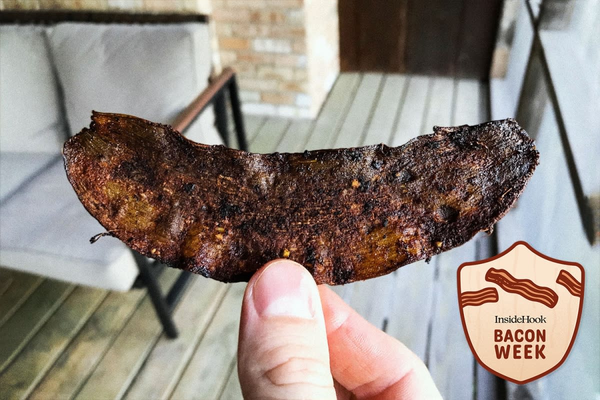 Holding up a crispy piece of banana peel bacon. The fake meat recipe went viral, but is it any good?