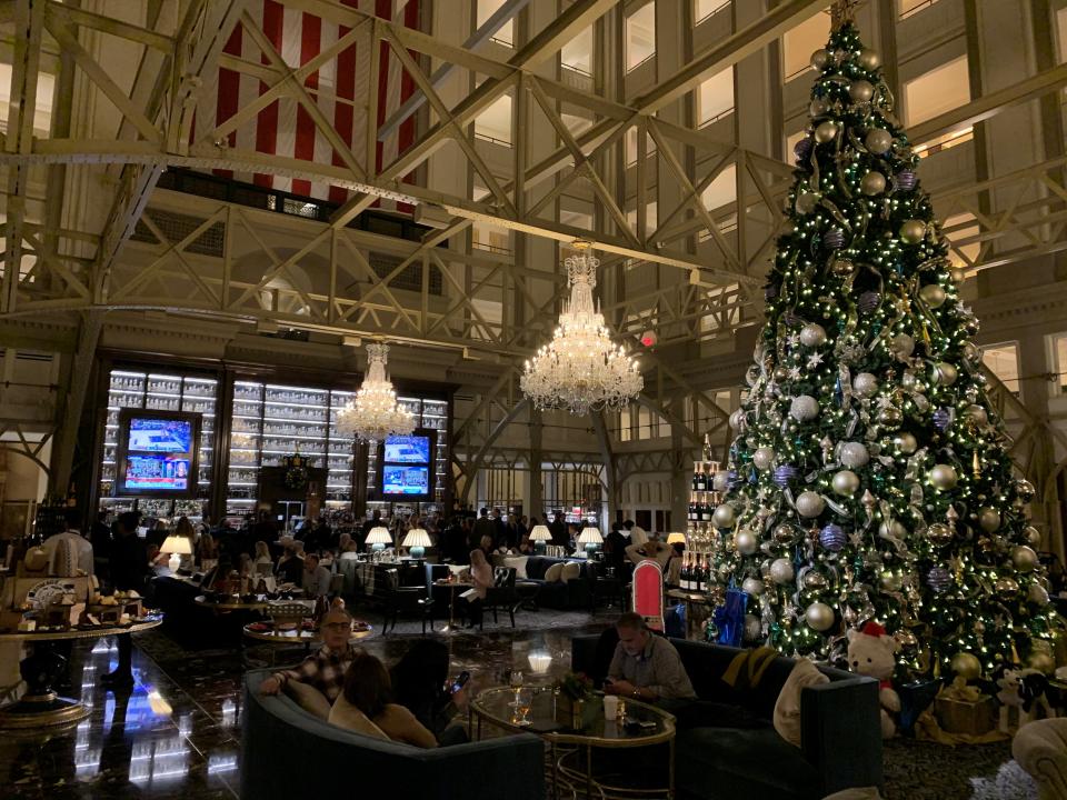 The lobby at the Trump International hotel in Washington, D.C., was showing the impeachment hearings on television, but not many were watching. Tourists stopped in, but largely to take selfies in front of the oversized Christmas tree.