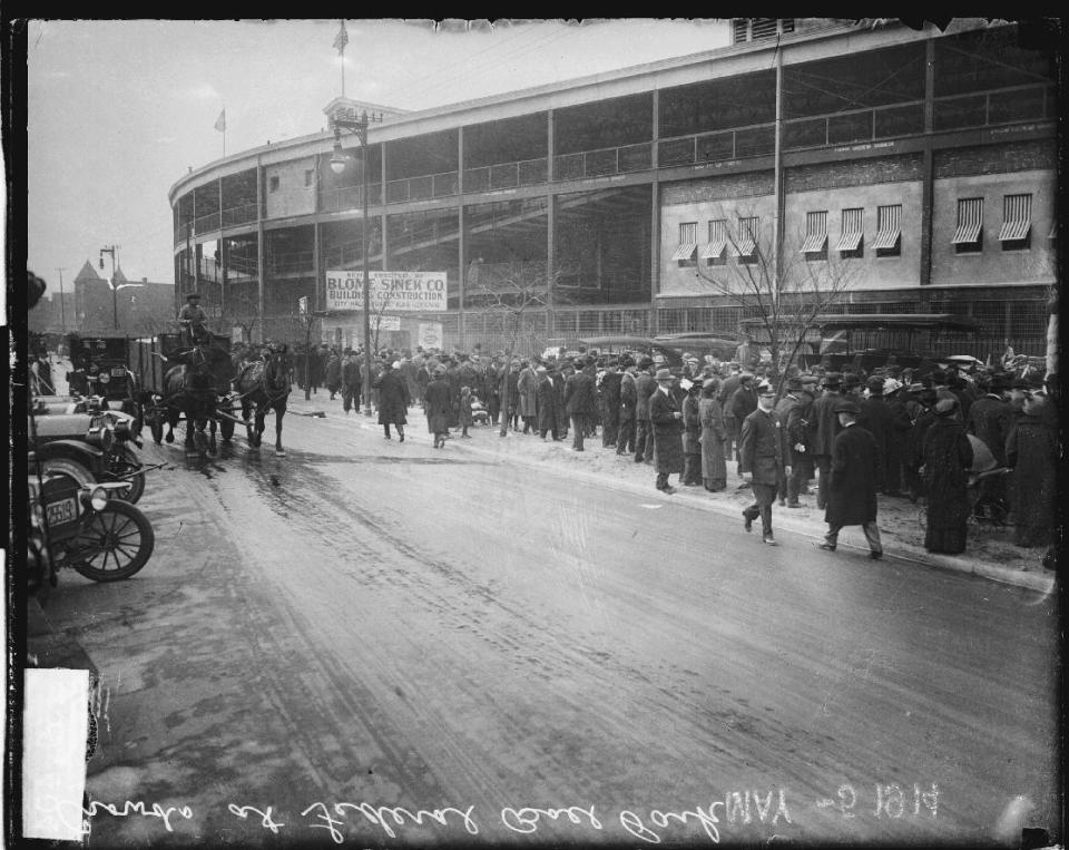 This May 14, 1914, photo provided by the Chicago History Museum shows crowds lining up along the sidewalk outside Weeghman Park in Chicago. Weeghman Park was home to Charlie Weeghman's Federal League team, the Chicago Whales. The Whales became the Chicago Cubs in 1916. Weeghman Park was renamed Wrigley Field in 1927. The famed ballpark will celebrate it's 100th anniversary on April 23, 2014. (AP Photo/Courtesy of the Chicago History Museum)