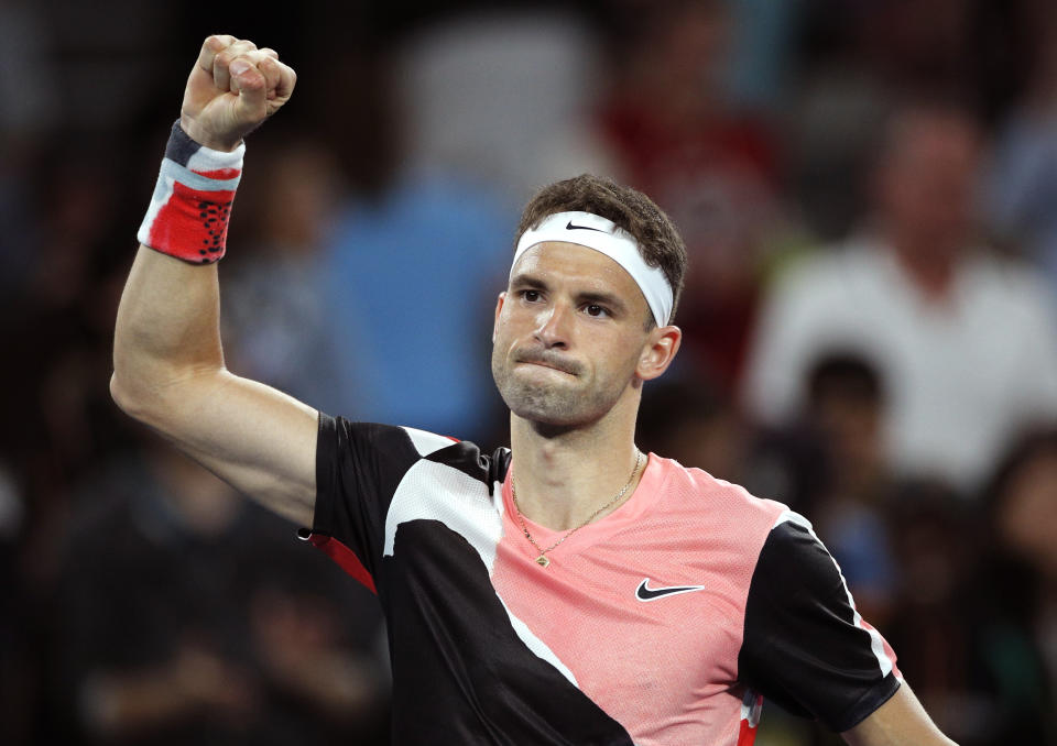 Bulgaria's Grigor Dimitrov celebrates after defeating Argentina's Juan Ignacio Londero in their first round singles match at the Australian Open tennis championship in Melbourne, Australia, Monday, Jan. 20, 2020. (AP Photo/Andy Wong)