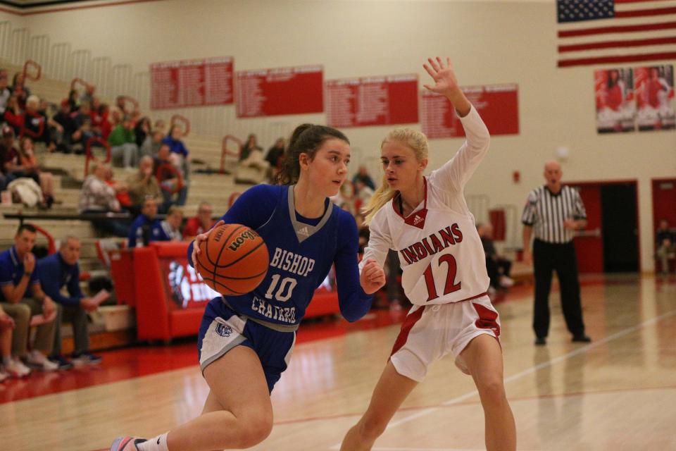 Bishop Chatard sophomore Alyx Kendall (left) attacks the right baseline against Twin Lakes junior Chloe Lucas (right) during the Twin Lakes Holiday Tournament on Thursday, Dec. 28, 2023.