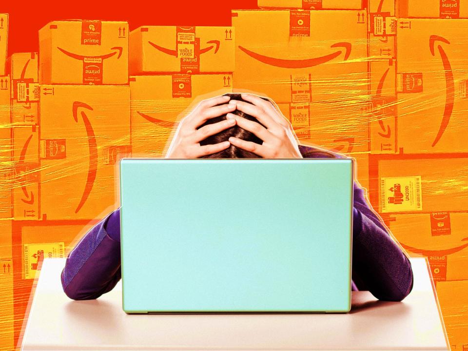 frustrated woman on laptop with her head in hands against an orange background with amazon packages stacked high