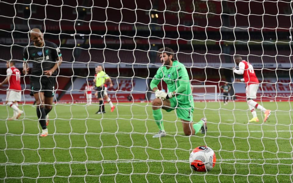 Alisson Becker of Liverpool fails to stop shot from Reiss Nelson of Arsenal scoring 2-1 -Liverpool blunders hand Arsenal a win with Premier League points record now off the table - Richard Pelham /NMC Pool 