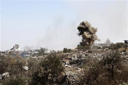 Smoke rises as a result of shelling from forces loyal to President Bashar al-Assad, according to activists, in Ariha countryside, September 7, 2013. REUTERS/Houssam Abo Dabak