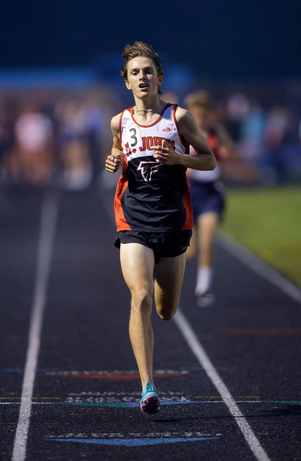 St. Johns' Joey Bowman wins the 3200 meter run during the MHSAA track and field 15-2 regional, Friday, May 19, 2023, at Mason High School.