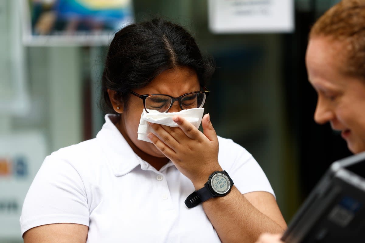 Student Hasena Mahmood reacts after receiving her A-Level results at City of London College (Getty Images)