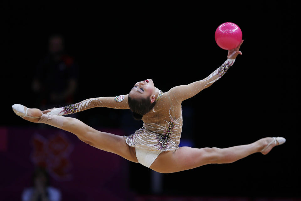 Azerbaijan's Aliya Garayeva competes using the ball in the individual all-around rhythmic gymnastics final at Wembley Arena during the London 2012 Olympic Games August 11, 2012. REUTERS/Marcelo Del Pozo (BRITAIN - Tags: SPORT GYMNASTICS OLYMPICS) 