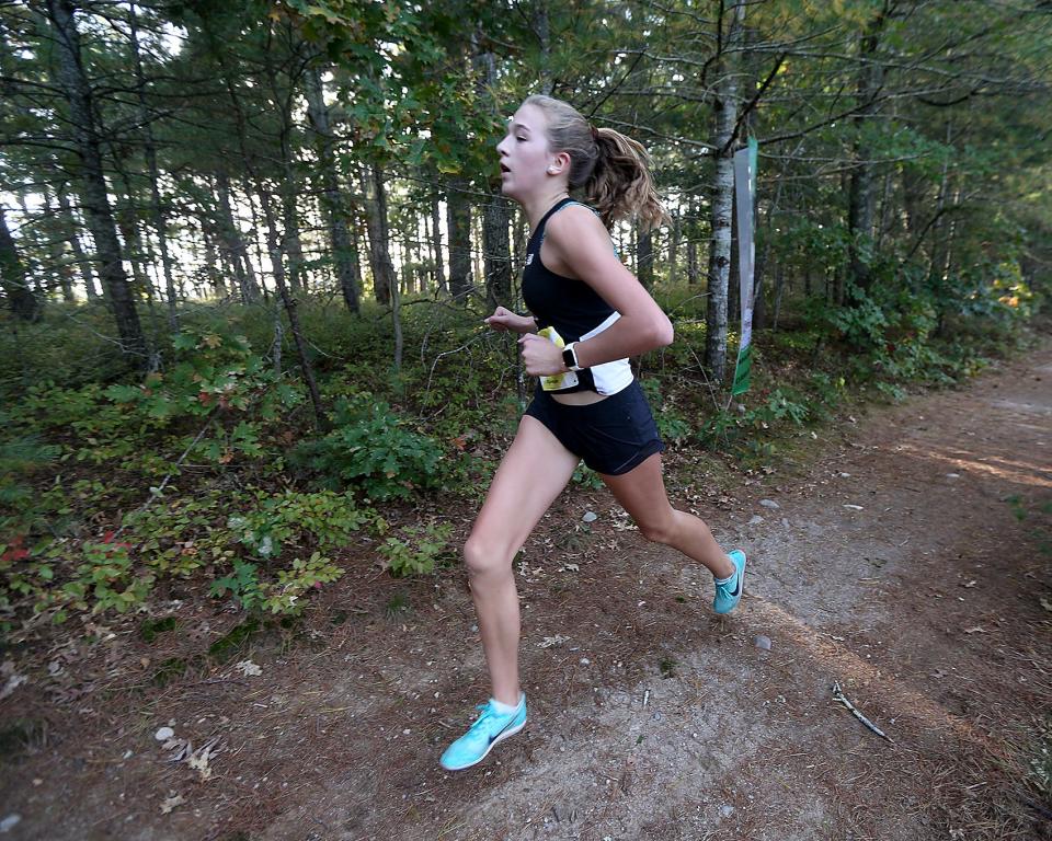 Hingham’s Clare Lowther takes second overall with a time of 18:59.72 in their meet against Marshfield at Marshfield High on Wednesday, Oct. 12, 2022. Marshfield girls would win 19-39 while Marshfield boys won 19-44. 
