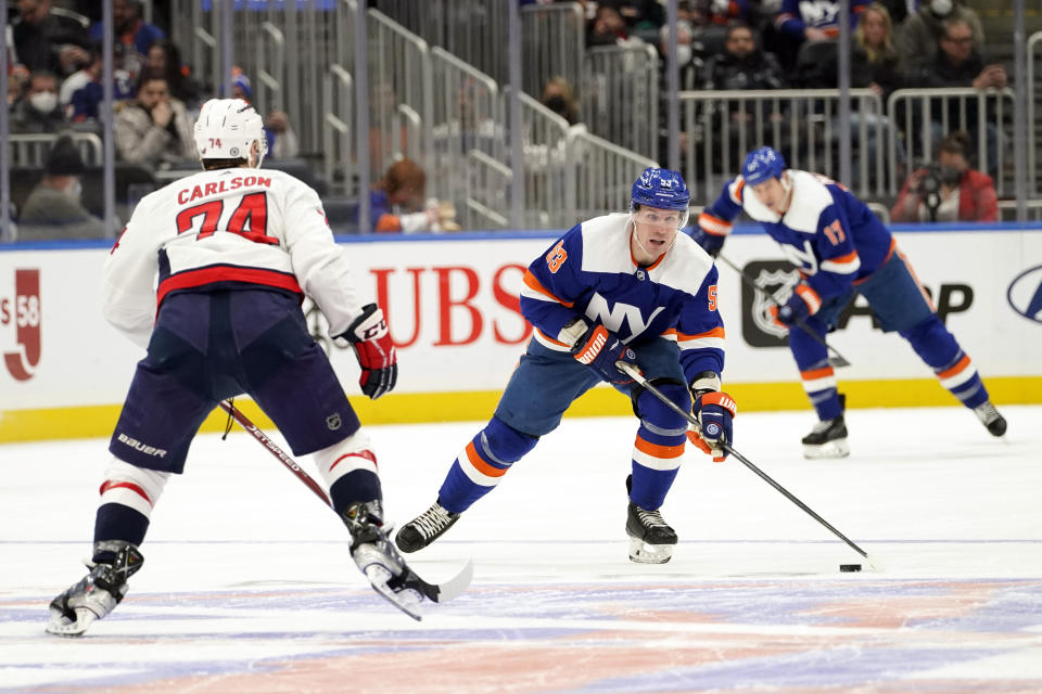 New York Islanders center Casey Cizikas (53) moves the puck up ice against Washington Capitals defenseman John Carlson (74) during the second period of an NHL hockey game, Saturday, Jan. 15, 2022, in Elmont, N.Y. (AP Photo/Mary Altaffer)