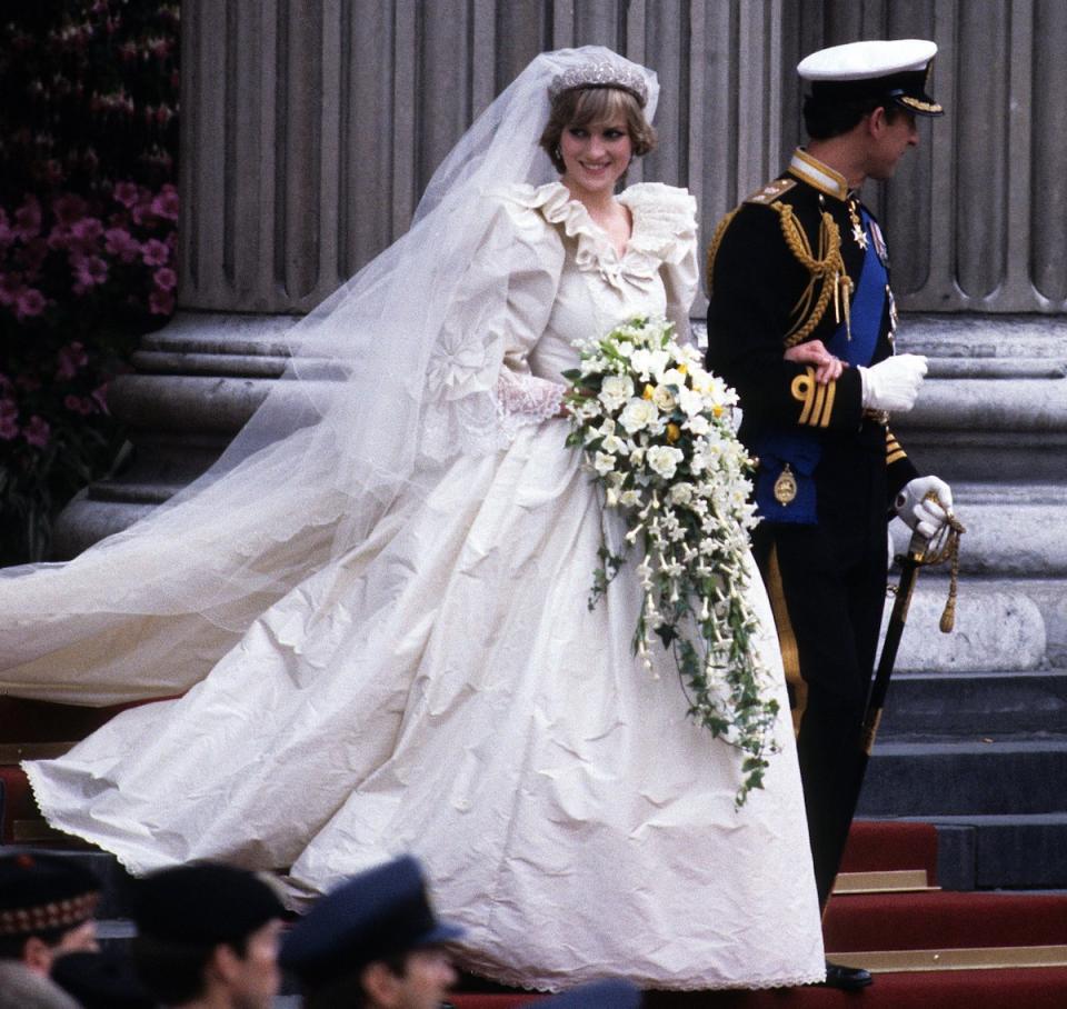 Prince Charles, Prince of Wales and Diana, Princess of Wales, wearing a wedding dress designed by David and Elizabeth Emanuel and the Spencer family Tiara, leave St. Paul's Cathedral following their wedding on July 29, 1981 in London, England