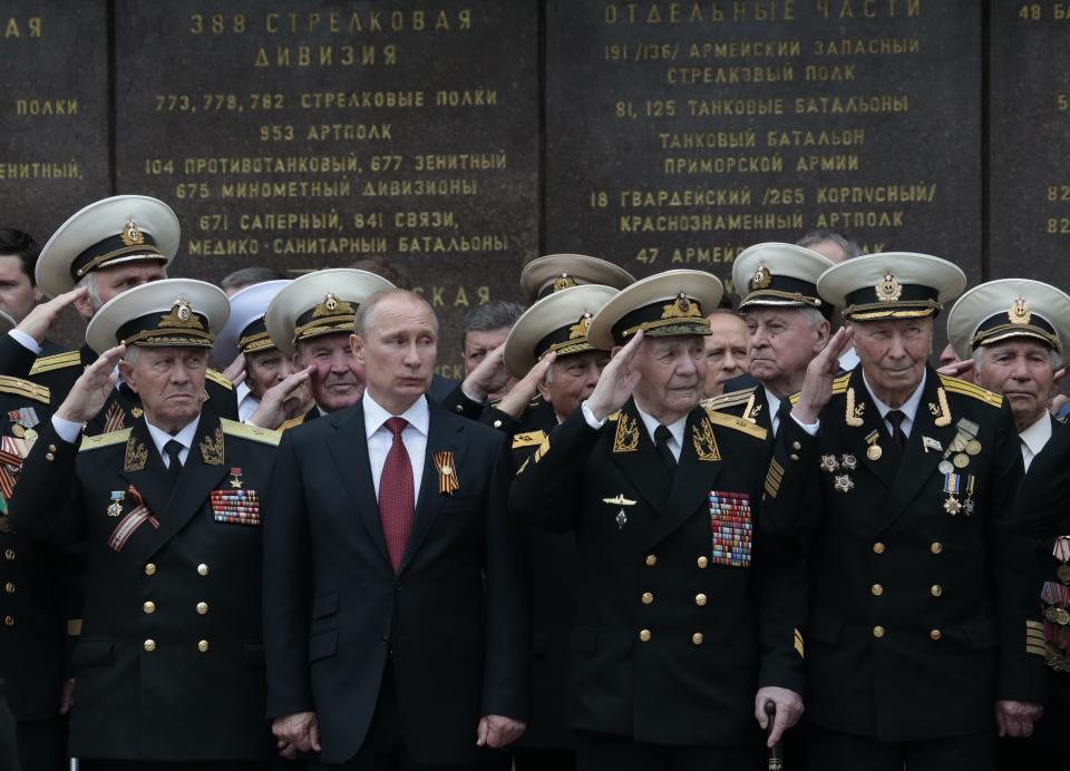 FILE - In this May 9, 2014 file photo, Russian President Vladimir Putin attends a parade marking the Victory Day in Sevastopol, Crimea. Russia's annexation of the Crimea region of Ukraine in March 2014 marked the climax of President Vladimir Putin's quest to restore Moscow's influence over its neighbors and reverse decades of perceived humiliation at the hands of the West. (AP Photo/Ivan Sekretarev, File)