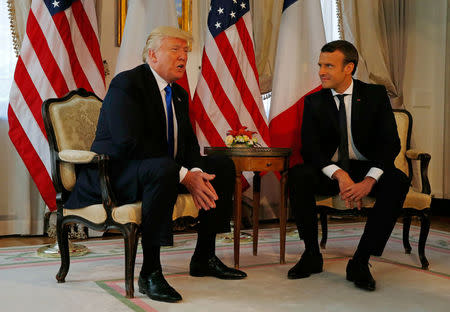 U.S. President Donald Trump (L) meets French President Emmanuel Macron before a working lunch ahead of a NATO Summit in Brussels, Belgium, May 25, 2017. REUTERS/Peter Dejong/Pool