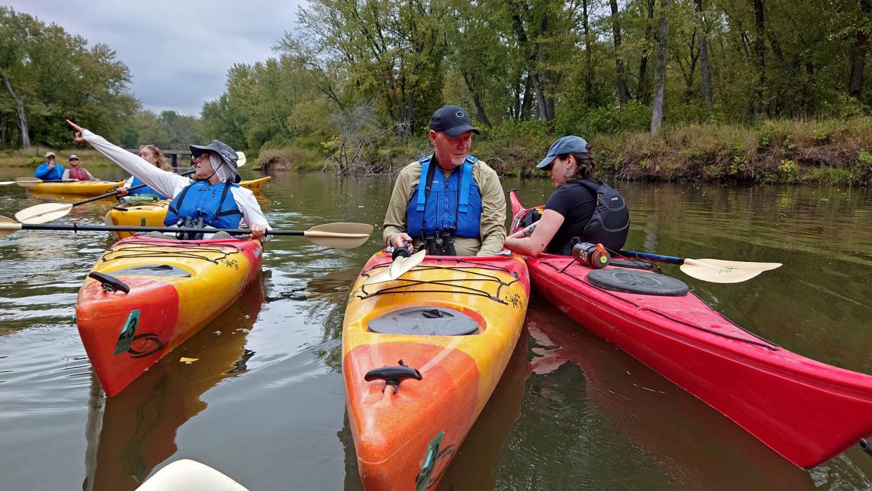 Broken Paddle Guiding Co., guide Isabel McNally, right, helps a client during a paddling trip on a tributary of the Mississippi River on Sept. 22 near Nelson, Wisconsin. McNally says it's u0022one of the great joysu0022 of her job to be able to connect people to the Mississippi River.