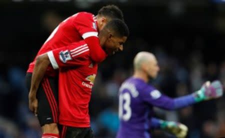 Football Soccer - Manchester City v Manchester United - Barclays Premier League - Etihad Stadium - 20/3/16 Manchester United's Marcus Rashford and Jesse Lingard celebrate at the end of the match Reuters / Phil Noble Livepic