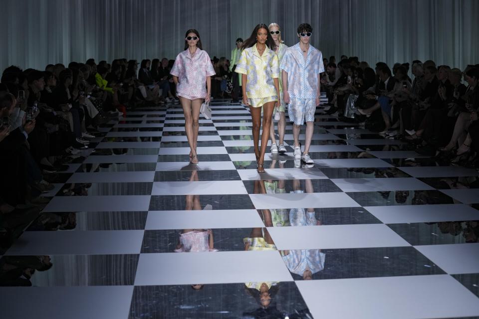 Models wear creations as part of the Versace women's Spring Summer 2024 collection presented in Milan, Italy, Friday, Sept. 22, 2023. (AP Photo/Antonio Calanni)