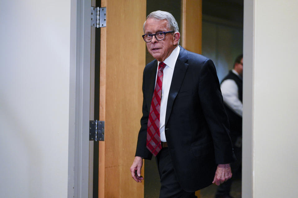 Ohio Gov. Mike DeWine arrives for a news conference, Friday, Dec. 29, 2023, in Columbus, Ohio. DeWine vetoed a measure Friday that would have banned gender-affirming care for minors and transgender athletes’ participation in girls and women’s sports, in a break from members of his party who championed the legislation. (AP Photo/Carolyn Kaster)