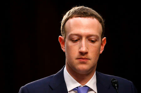 FILE PHOTO: Facebook CEO Mark Zuckerberg listens while testifying before a joint Senate Judiciary and Commerce Committees hearing regarding the company’s use and protection of user data, on Capitol Hill in Washington, U.S., April 10, 2018. REUTERS/Leah Millis/File Photo