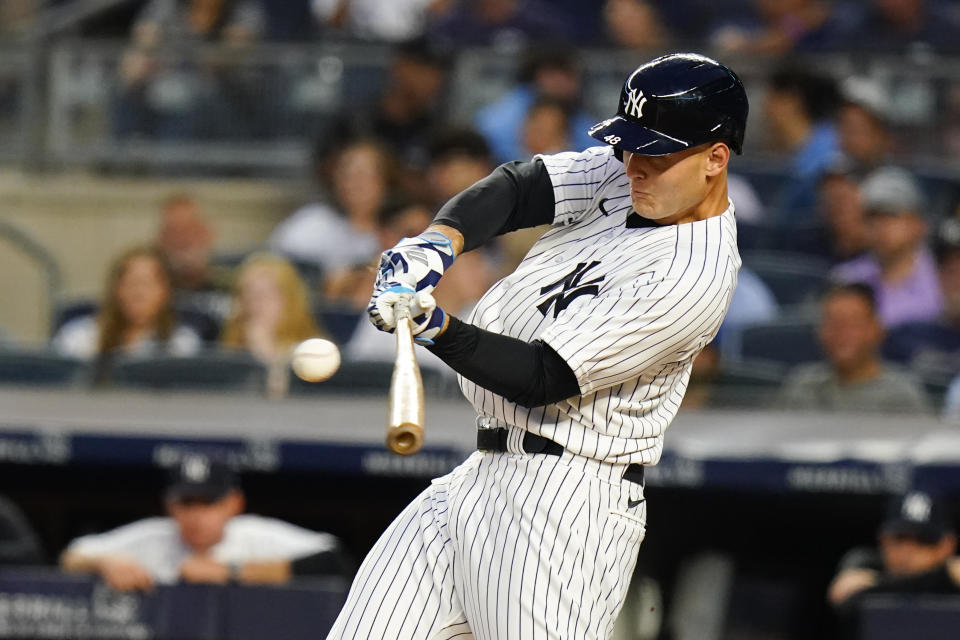 New York Yankees' Anthony Rizzo hits a two-run single during the first inning of the team's baseball game against the Cincinnati Reds on Tuesday, July 12, 2022, in New York. (AP Photo/Frank Franklin II)